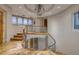Elegant hallway with hardwood floors, curved staircase, and modern glass railings at , Henderson, NV 89011