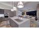Modern open-concept kitchen with island, stainless appliances, and adjacent living area, perfect for entertaining at , Henderson, NV 89011