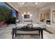 Bright living room featuring neutral tones, fireplace, and seamless access to an outdoor patio with lake views at , Henderson, NV 89011