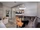 Comfortable living room with modern lighting fixture and view to open-concept kitchen at , Henderson, NV 89011