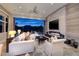 Serene living room with lake views, fireplace, and seamless indoor-outdoor living at , Henderson, NV 89011