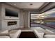 Main bedroom with fireplace, TV, sitting area, and a view of the beautiful lake at , Henderson, NV 89011