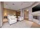 This main bedroom features a sitting area, a fireplace, and built-in shelving at , Henderson, NV 89011