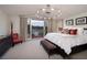 Bright main bedroom with lake views, a large bed, and access to a private balcony at , Henderson, NV 89011