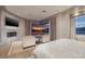 Main bedroom featuring a fireplace, TV, sitting area, and a view of the lake at , Henderson, NV 89011