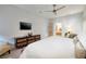 Cozy main bedroom with a TV, ample natural light, and a view into the en suite bathroom at , Henderson, NV 89011