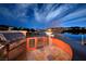 Modern outdoor kitchen equipped with a grill, refrigerator, and sleek countertops at , Henderson, NV 89011