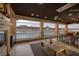 Outdoor living area with a fireplace, ceiling fan, and beautiful lake views at , Henderson, NV 89011