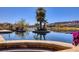 Beautiful pool with lush landscaping and scenic lake views, perfect for relaxation at , Henderson, NV 89011