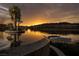 Lush poolside views with a boat dock, and a stunning sunset reflection on the water at , Henderson, NV 89011