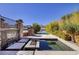 Beautiful pool with a serene view, featuring stone accents and lush landscaping for a tranquil outdoor experience at , Henderson, NV 89011