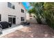 Spacious backyard with desert landscaping, patio, and barbecue, perfect for outdoor entertaining at 1030 Wild Fern Ct, Las Vegas, NV 89183