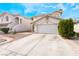 Inviting two-story home with a paved driveway and well-kept landscaping; featuring a spacious two-car garage at 1030 Wild Fern Ct, Las Vegas, NV 89183
