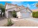 Charming two-story home showcasing a well-maintained front yard, neutral color palette, and a two-car garage at 1030 Wild Fern Ct, Las Vegas, NV 89183