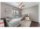 Bright living room with a comfortable gray sectional couch and natural light at 1030 Wild Fern Ct, Las Vegas, NV 89183