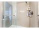 Modern shower with glass doors, tiled walls, and built-in shelves at 1030 Wild Fern Ct, Las Vegas, NV 89183
