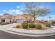 Charming single story home boasts a well-maintained front yard with attractive desert landscaping at 1073 Fishing St, Henderson, NV 89011