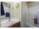 Bathroom featuring a sink, vanity, and shower-tub combo with tiled surround at 1156 Harts Bluff Pl # 3, Henderson, NV 89002