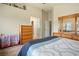 Spacious bedroom features neutral walls and carpet flooring with a door leading to the Primary bathroom at 1156 Harts Bluff Pl # 3, Henderson, NV 89002