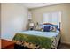 Bright bedroom with a comfortable bed, natural light from the window and a shelf for display at 1156 Harts Bluff Pl # 3, Henderson, NV 89002
