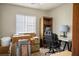 Bedroom with a desk, chair, and shelving, filled with boxes at 1156 Harts Bluff Pl # 3, Henderson, NV 89002