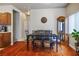 Dining room featuring a table with six chairs, a china cabinet, and view into the kitchen at 1156 Harts Bluff Pl # 3, Henderson, NV 89002