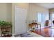 Inviting entryway with a white front door, wooden table, and decorative accents at 1156 Harts Bluff Pl # 3, Henderson, NV 89002