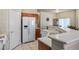 Bright kitchen featuring modern appliances, ample counter space, and white cabinets and a side-by-side refrigerator at 1156 Harts Bluff Pl # 3, Henderson, NV 89002