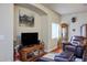 Living room features an arched wall nook, a painting, and lots of room to relax at 1156 Harts Bluff Pl # 3, Henderson, NV 89002
