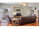 Living room with an open floor plan, hard wood floors, large window, and a glass sliding door at 1156 Harts Bluff Pl # 3, Henderson, NV 89002