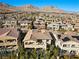 Expansive view of a luxury home featuring balcony and a pristine pool in a picturesque neighborhood at 12125 Edgehurst Ct, Las Vegas, NV 89138