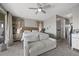 This bedroom features a seating area, a neutral color palette, and access to a private balcony at 12125 Edgehurst Ct, Las Vegas, NV 89138