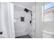 Bathroom with modern rain shower and white marble-look tile at 1216 Padre Serra Ln, Las Vegas, NV 89134