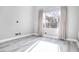 Bright bedroom with hardwood floors and natural light coming in from the window at 1216 Padre Serra Ln, Las Vegas, NV 89134