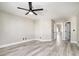 Spacious bedroom with wood-look flooring and ample natural light at 1216 Padre Serra Ln, Las Vegas, NV 89134