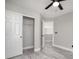 Bedroom with sliding closet doors, wood-look floors, and neutral paint at 1216 Padre Serra Ln, Las Vegas, NV 89134