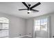 Bright bedroom with a modern ceiling fan and natural light from the window at 1216 Padre Serra Ln, Las Vegas, NV 89134