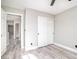 Bedroom with wood-look floors, slider closet and open entry at 1216 Padre Serra Ln, Las Vegas, NV 89134