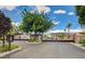 Gated community entrance with mature landscaping and a private, secure setting at 1216 Padre Serra Ln, Las Vegas, NV 89134