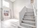 Living space with staircase and light-colored hardwood floors at 1216 Padre Serra Ln, Las Vegas, NV 89134