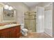 Bathroom with a glass enclosed shower, vanity with a framed mirror, and tile flooring at 14 Camino Barcelona Pl, Henderson, NV 89011