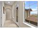 Well-lit hallway with french doors and views of the outdoors from a window at 14 Camino Barcelona Pl, Henderson, NV 89011