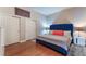 Comfortable bedroom featuring a tufted blue headboard bed at 150 Las Vegas Blvd # 1014, Las Vegas, NV 89101