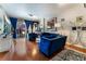 Modern living room with stylish blue velvet furniture, wood floors, and city view at 150 Las Vegas Blvd # 1014, Las Vegas, NV 89101