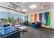 Bright and colorful lounge area features comfortable seating and panoramic city views through expansive windows at 150 Las Vegas Blvd # 1014, Las Vegas, NV 89101