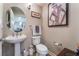 Stylish powder room with pedestal sink and decorative artwork at 150 Las Vegas Blvd # 1014, Las Vegas, NV 89101
