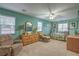 Cozy bedroom with a ceiling fan, and a cushioned armchair at 1532 Via Cassia, Henderson, NV 89052