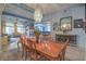 Open dining room featuring a chandelier, light blue walls, and access to other living spaces at 1532 Via Cassia, Henderson, NV 89052