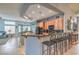 Open concept kitchen features granite countertops, raised breakfast bar, and stainless appliances at 1532 Via Cassia, Henderson, NV 89052