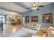 Open-concept living area with large windows and a view of the dining area at 1532 Via Cassia, Henderson, NV 89052